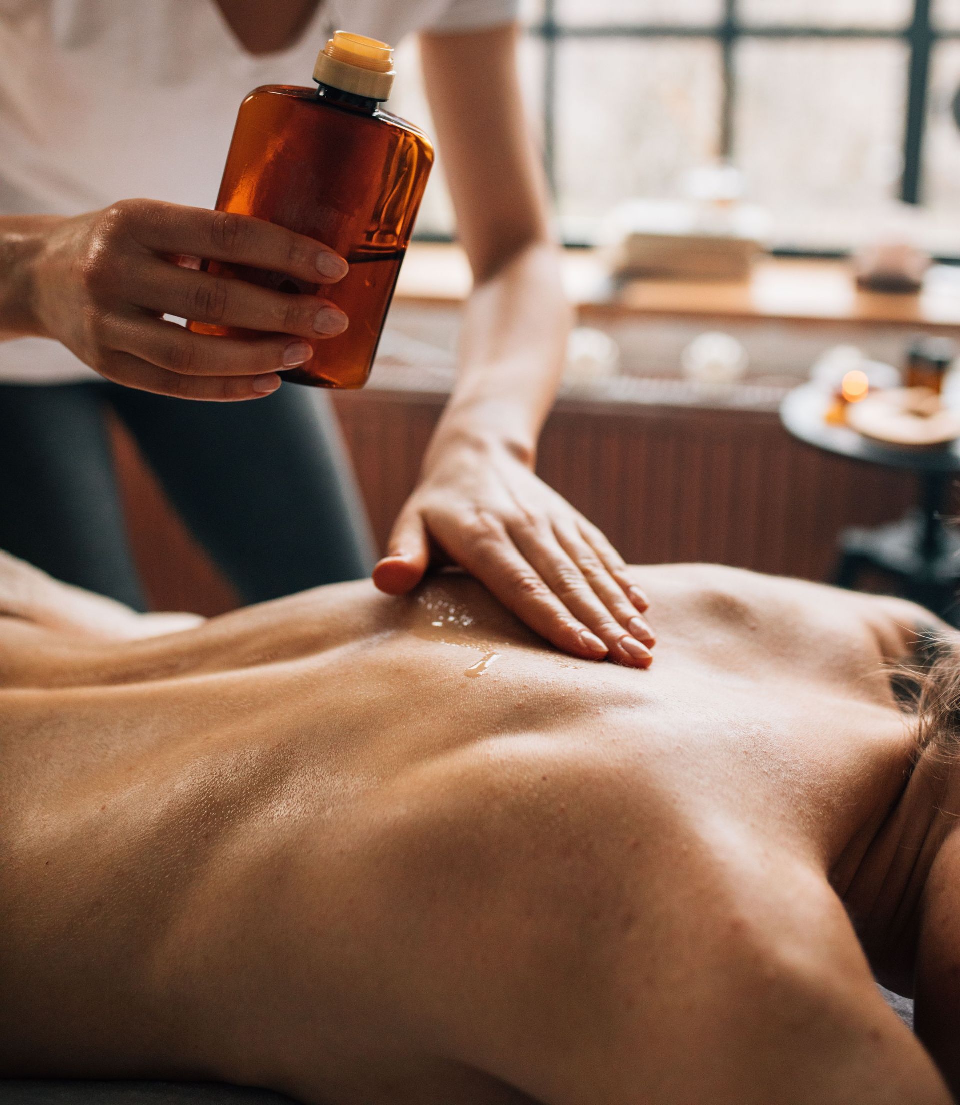 Professional spa massage using essential oils for ultimate relaxation and self-care.
